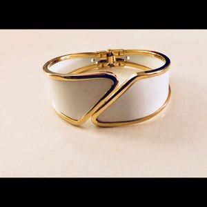 A gold and white bracelet.